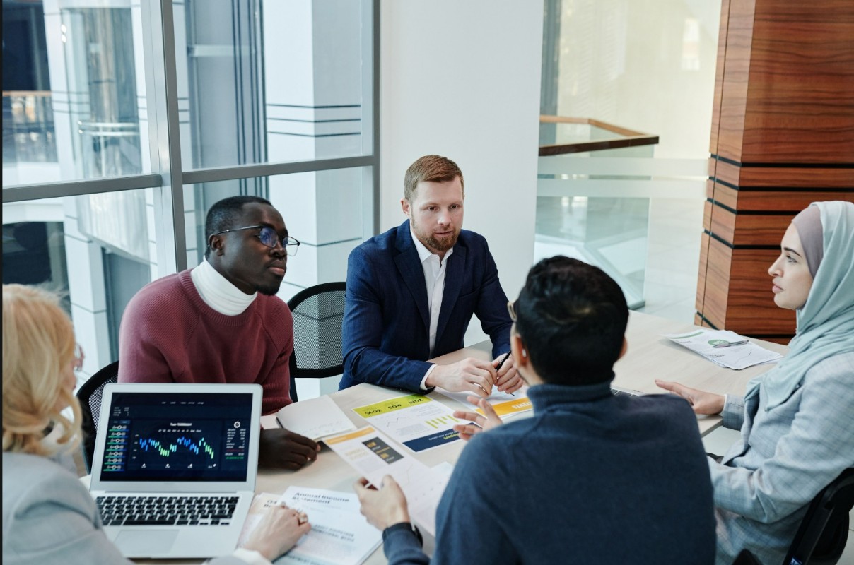 A diverse international team at work — buyer discovery, pricing, shipment planning.